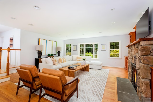 17 Joanne Ln, Weston, CT 06883 - living area with a stone fireplace, light wood-type flooring, baseboards, and recessed lighting