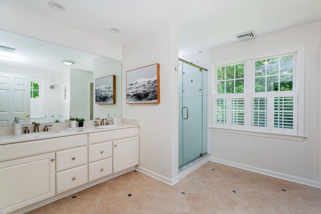 17 Joanne Ln, Weston, CT 06883 - bathroom featuring double vanity, a stall shower, tile patterned floors, and healthy amount of natural light
