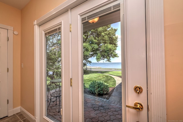 660 Ocean Ave, West Haven, CT 06516 - doorway with a water view and tile patterned floors