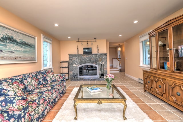 660 Ocean Ave, West Haven, CT 06516 - living room with tile patterned flooring, recessed lighting, a baseboard heating unit, and a fireplace