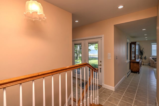 660 Ocean Ave, West Haven, CT 06516 - corridor featuring an upstairs landing, a baseboard heating unit, recessed lighting, and tile patterned floors