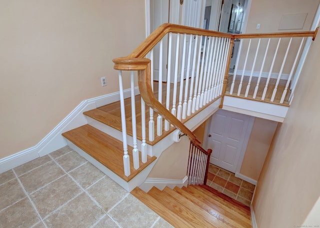660 Ocean Ave, West Haven, CT 06516 - staircase with baseboards and tile patterned flooring