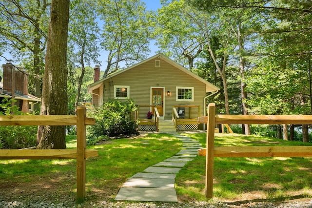 15 Fedus Dr, East Haddam, CT 06415 - view of front of property with a chimney, a front lawn, and a deck