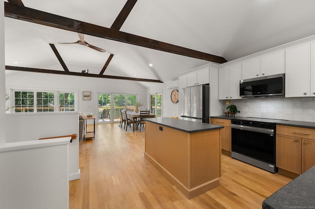 15 Fedus Dr, East Haddam, CT 06415 - kitchen with appliances with stainless steel finishes, dark countertops, a kitchen island, backsplash, and recessed lighting