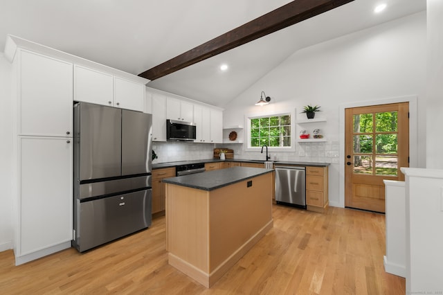 15 Fedus Dr, East Haddam, CT 06415 - kitchen with stainless steel appliances, open shelves, a sink, dark countertops, and tasteful backsplash