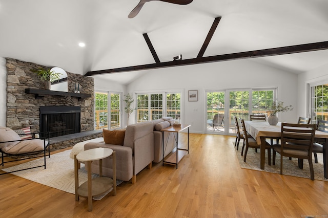 15 Fedus Dr, East Haddam, CT 06415 - living area featuring beam ceiling, a stone fireplace, light wood-style flooring, ceiling fan, and high vaulted ceiling