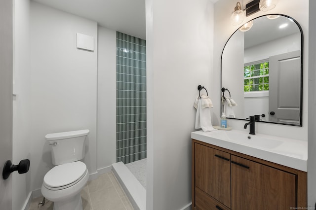 15 Fedus Dr, East Haddam, CT 06415 - bathroom with vanity, toilet, a tile shower, tile patterned flooring, and baseboards