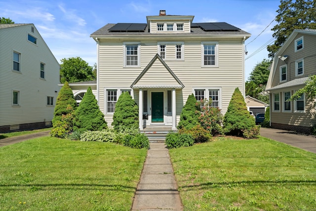 1748 Whitney Ave, Hamden, CT 06517 - traditional style home with a front yard, solar panels, and a chimney