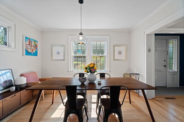 1748 Whitney Ave, Hamden, CT 06517 - dining area featuring light wood-style floors and ornamental molding