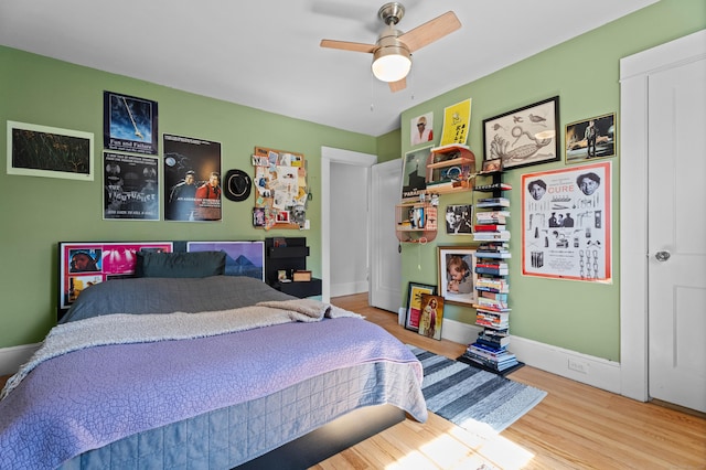 1748 Whitney Ave, Hamden, CT 06517 - bedroom featuring wood finished floors, a ceiling fan, and baseboards