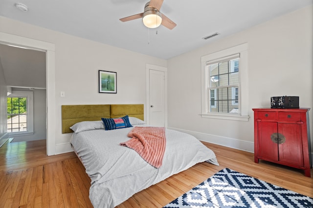 1748 Whitney Ave, Hamden, CT 06517 - bedroom featuring baseboards, wood finished floors, and a ceiling fan