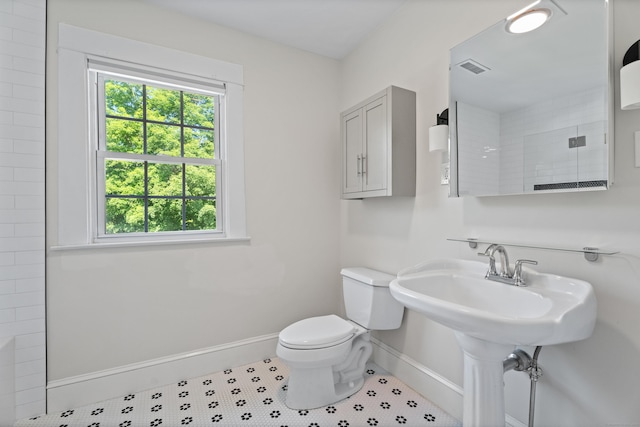 1748 Whitney Ave, Hamden, CT 06517 - bathroom featuring baseboards, healthy amount of natural light, toilet, and a sink