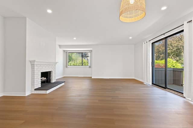 156 Apache Ln Unit A, Stratford, CT 06614 - unfurnished living room with wood finished floors, recessed lighting, a fireplace, and baseboards