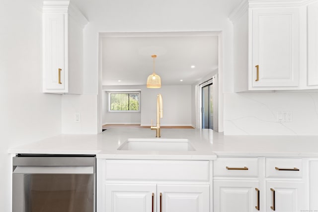 156 Apache Ln Unit A, Stratford, CT 06614 - kitchen featuring dishwasher, a sink, light countertops, and white cabinets