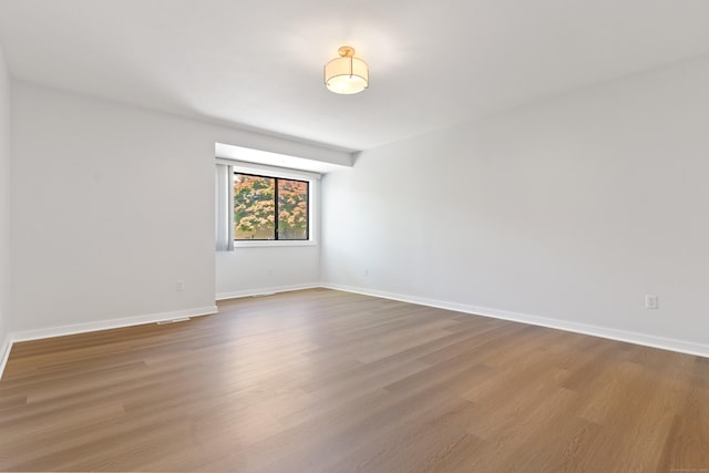 156 Apache Ln Unit A, Stratford, CT 06614 - empty room featuring wood finished floors and baseboards