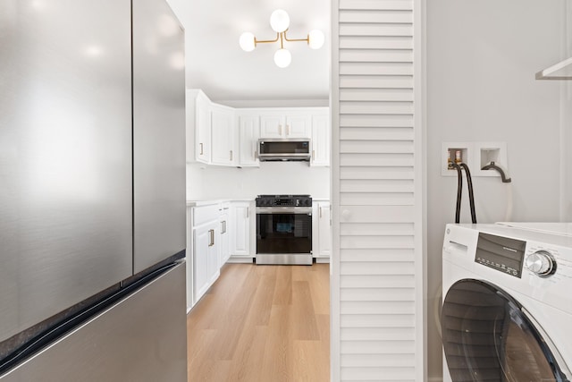 156 Apache Ln Unit A, Stratford, CT 06614 - washroom featuring washer / clothes dryer and light wood finished floors