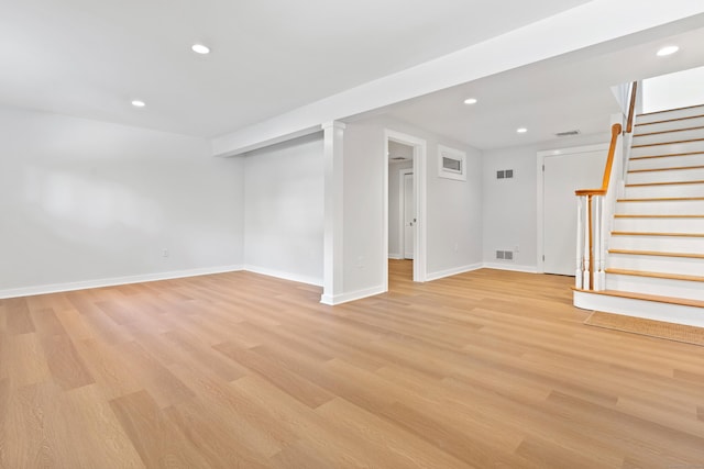 156 Apache Ln Unit A, Stratford, CT 06614 - finished basement with light wood finished floors, baseboards, stairs, and recessed lighting