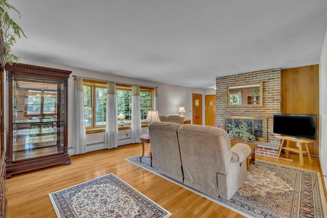 566 Beach Pond Rd, Voluntown, CT 06384 - living room featuring a brick fireplace and wood finished floors