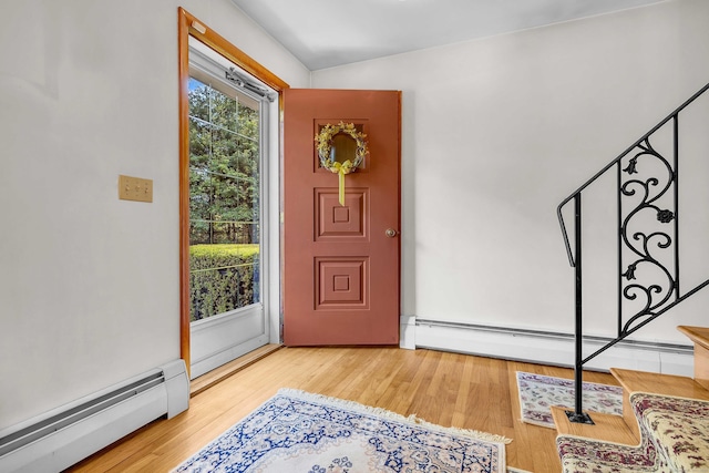 566 Beach Pond Rd, Voluntown, CT 06384 - foyer with baseboard heating, stairway, and wood finished floors