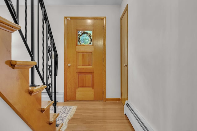 566 Beach Pond Rd, Voluntown, CT 06384 - foyer with stairway, a baseboard heating unit, and light wood-style floors