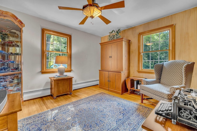 566 Beach Pond Rd, Voluntown, CT 06384 - living area featuring a baseboard heating unit, plenty of natural light, and a ceiling fan