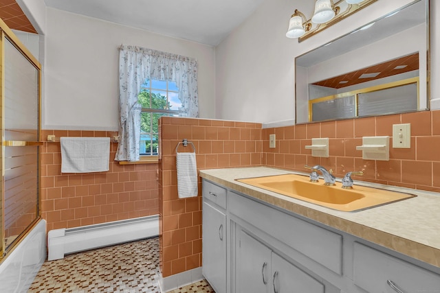 566 Beach Pond Rd, Voluntown, CT 06384 - full bath featuring tile walls, a baseboard heating unit, vanity, bath / shower combo with glass door, and wainscoting