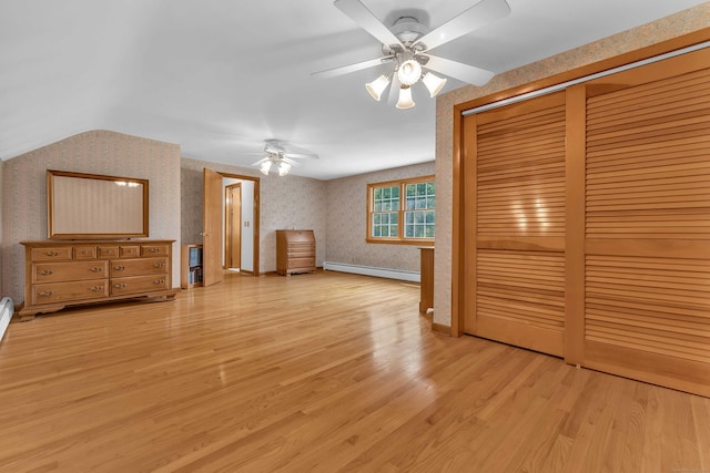 566 Beach Pond Rd, Voluntown, CT 06384 - unfurnished bedroom with baseboard heating, light wood-style floors, a closet, wallpapered walls, and a ceiling fan
