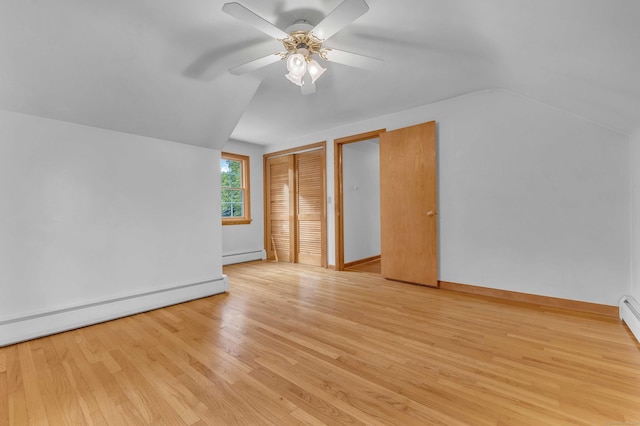 566 Beach Pond Rd, Voluntown, CT 06384 - unfurnished bedroom with baseboard heating, lofted ceiling, light wood-style flooring, a closet, and ceiling fan