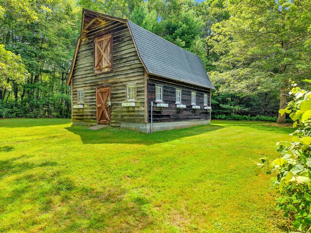566 Beach Pond Rd, Voluntown, CT 06384 - view of home's exterior featuring a barn, an outbuilding, and a yard