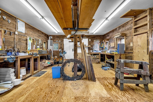 566 Beach Pond Rd, Voluntown, CT 06384 - misc room with a workshop area, wood finished floors, plenty of natural light, and wooden walls