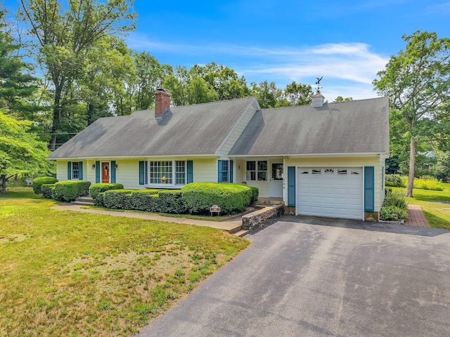 566 Beach Pond Rd, Voluntown, CT 06384 - view of front facade with an attached garage, a chimney, driveway, and a front lawn