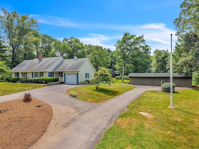 566 Beach Pond Rd, Voluntown, CT 06384 - ranch-style home featuring a front lawn, a chimney, an attached garage, and driveway