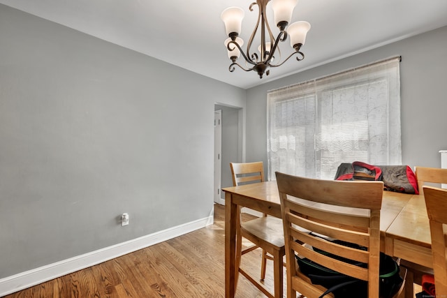 22 Hillside Ave, Torrington, CT 06790 - dining room with wood finished floors, a chandelier, and baseboards