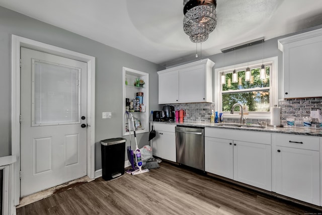 22 Hillside Ave, Torrington, CT 06790 - kitchen featuring stainless steel dishwasher, a sink, dark wood-type flooring, tasteful backsplash, and white cabinets