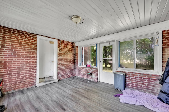 22 Hillside Ave, Torrington, CT 06790 - unfurnished sunroom with brick wall, plenty of natural light, wood finished floors, and wood ceiling