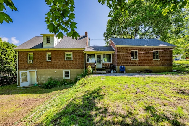 22 Hillside Ave, Torrington, CT 06790 - rear view of property with a lawn, brick siding, a chimney, and a shingled roof
