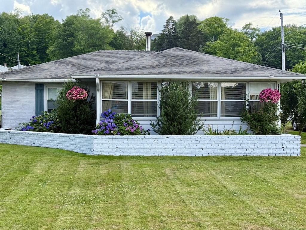 115 Paddock Ave, Meriden, CT 06450 - view of front of house with roof with shingles and a front yard
