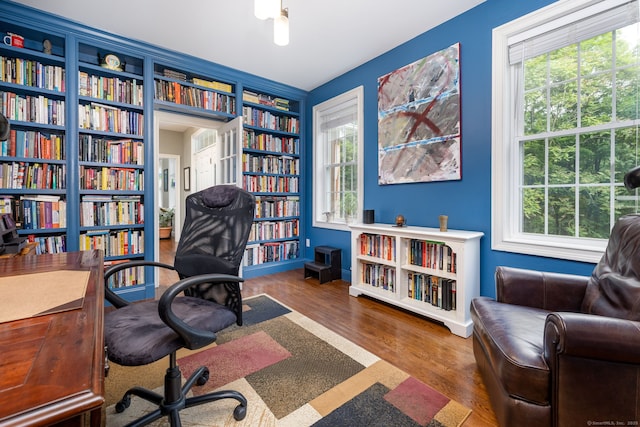 133 Hoop Pole Hill Rd, Woodbury, CT 06798 - office space featuring built in features, wood finished floors, bookshelves, and baseboards
