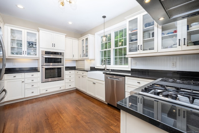 133 Hoop Pole Hill Rd, Woodbury, CT 06798 - kitchen featuring appliances with stainless steel finishes, a sink, dark wood-style floors, dark countertops, and recessed lighting