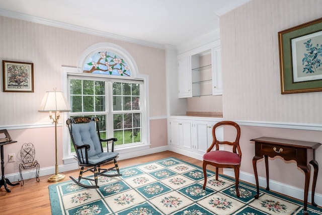 10 Deer Park Rd, Danbury, CT 06811 - sitting room featuring wallpapered walls, crown molding, light wood-style flooring, and baseboards