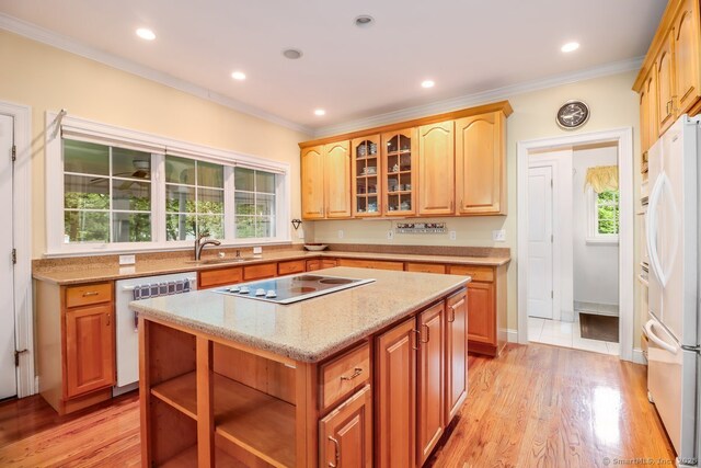 10 Deer Park Rd, Danbury, CT 06811 - kitchen featuring white appliances, crown molding, healthy amount of natural light, light stone countertops, and a center island