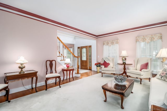 10 Deer Park Rd, Danbury, CT 06811 - living area with ornamental molding, wood finished floors, stairway, and baseboards