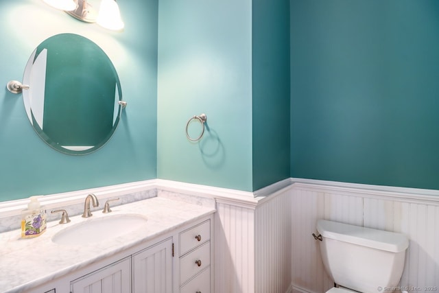 10 Deer Park Rd, Danbury, CT 06811 - bathroom with wainscoting, toilet, and vanity