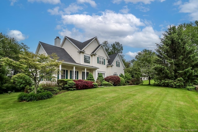 10 Deer Park Rd, Danbury, CT 06811 - view of front of home featuring a front lawn and a chimney