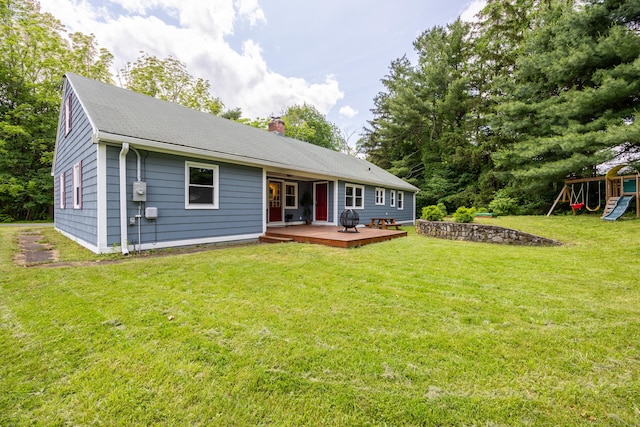126 Newfield St, Middletown, CT 06457 - back of house with a chimney, a wooden deck, a playground, and a yard
