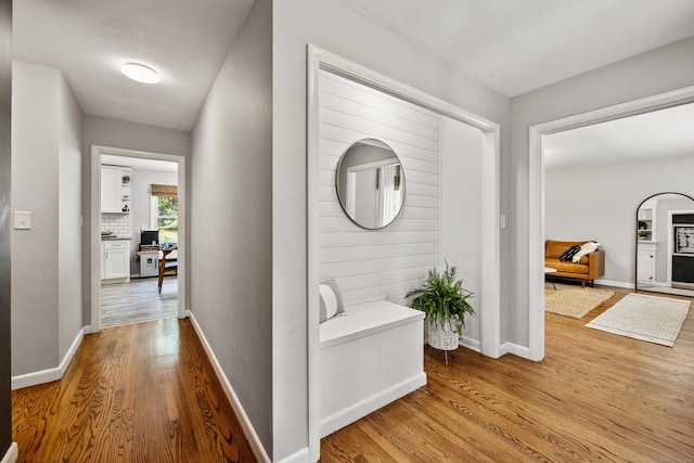126 Newfield St, Middletown, CT 06457 - hallway with light wood-type flooring, baseboards, and an office area