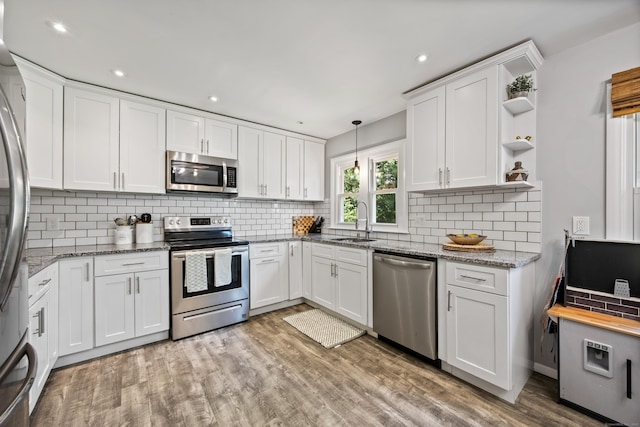 126 Newfield St, Middletown, CT 06457 - kitchen featuring stainless steel appliances, a sink, open shelves, white cabinets, and recessed lighting