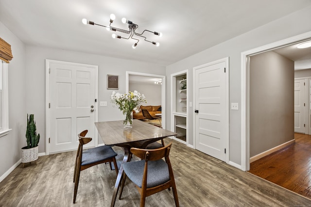 126 Newfield St, Middletown, CT 06457 - dining area featuring wood finished floors, a chandelier, and baseboards
