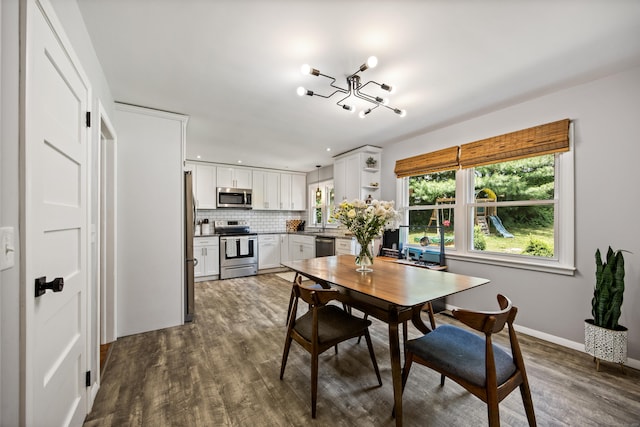 126 Newfield St, Middletown, CT 06457 - dining room featuring a chandelier, dark wood-style floors, and baseboards
