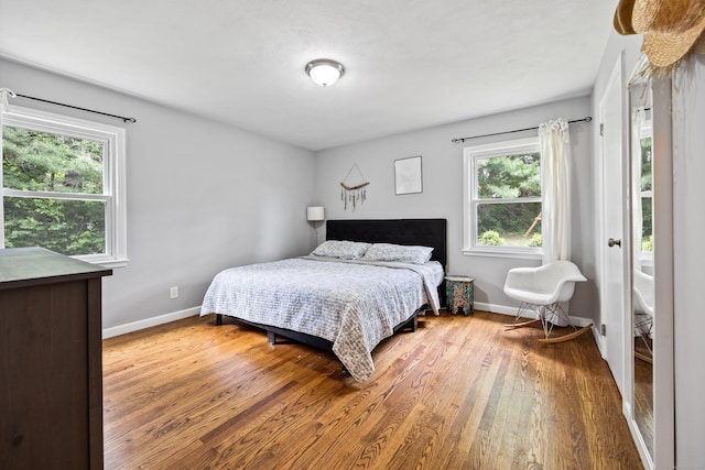 126 Newfield St, Middletown, CT 06457 - bedroom with wood finished floors, multiple windows, and baseboards